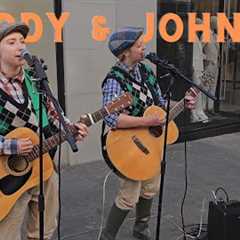 Paddy & Johnny are two ladies dressed up as old farmer men singing I'll Tell Me Ma