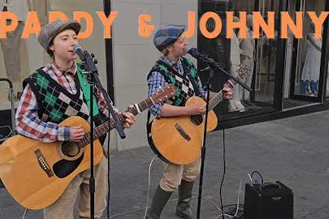 Paddy & Johnny are two ladies dressed up as old farmer men singing I'll Tell Me Ma